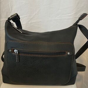 Like New Roots Bag Leather Cross body Color Is Dark Grey No Wear At all